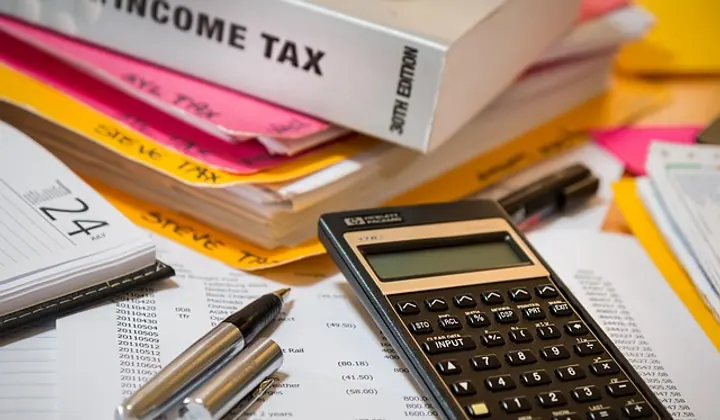 Payroll support team handling payroll documents
